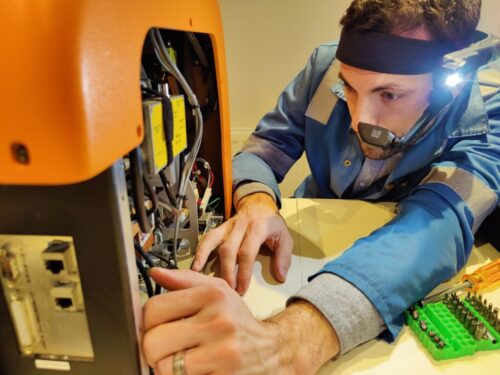 Field services engineer using AR technology to service instruments